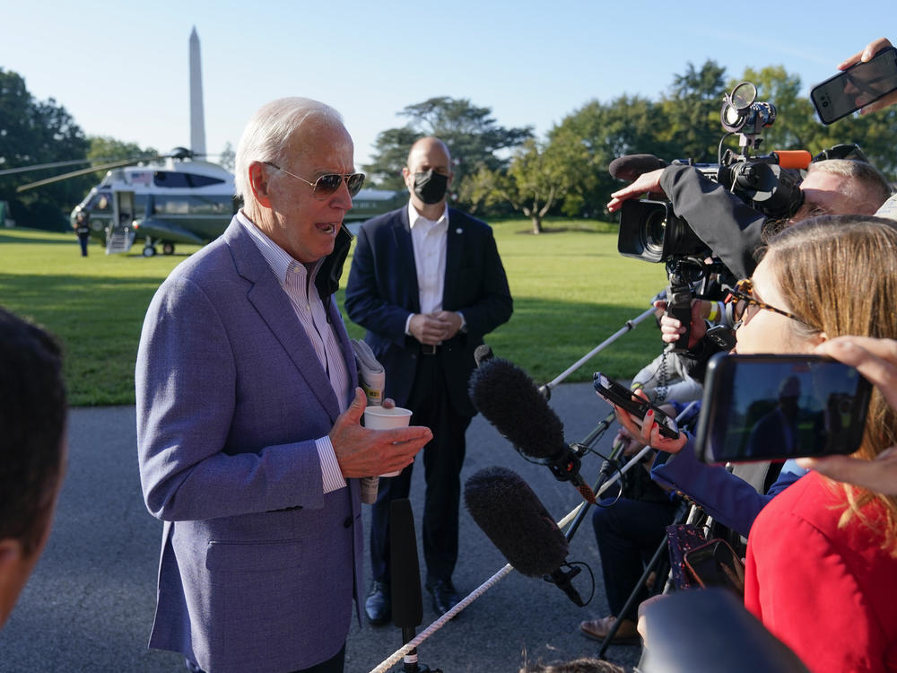 President Joe Biden speaks with members of the press before boarding Marine One on the South Lawn of the White House, Saturday, Oct. 2, 2021, in Washington. Biden spent the weekend at his home in Delaware.