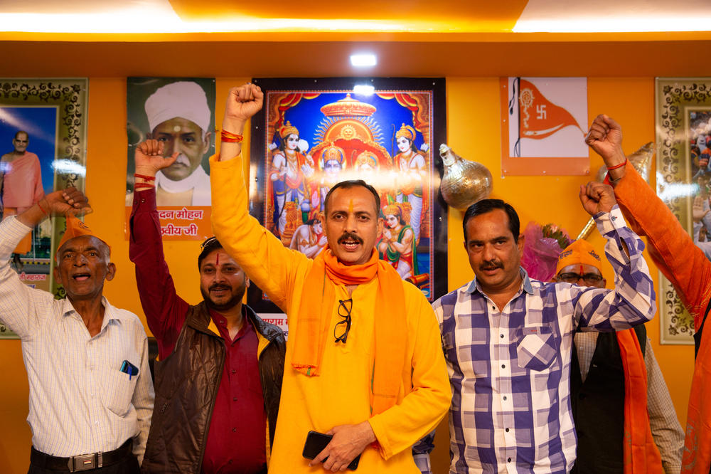 Pankaj Tiwari (center), 47, chants Hindu nationalist slogans with fellow members of the Hindu Mahasabha, a far-right extremist group, at their office in Lucknow, the capital of India's Uttar Pradesh state. Tiwari is the group's local Lucknow leader.