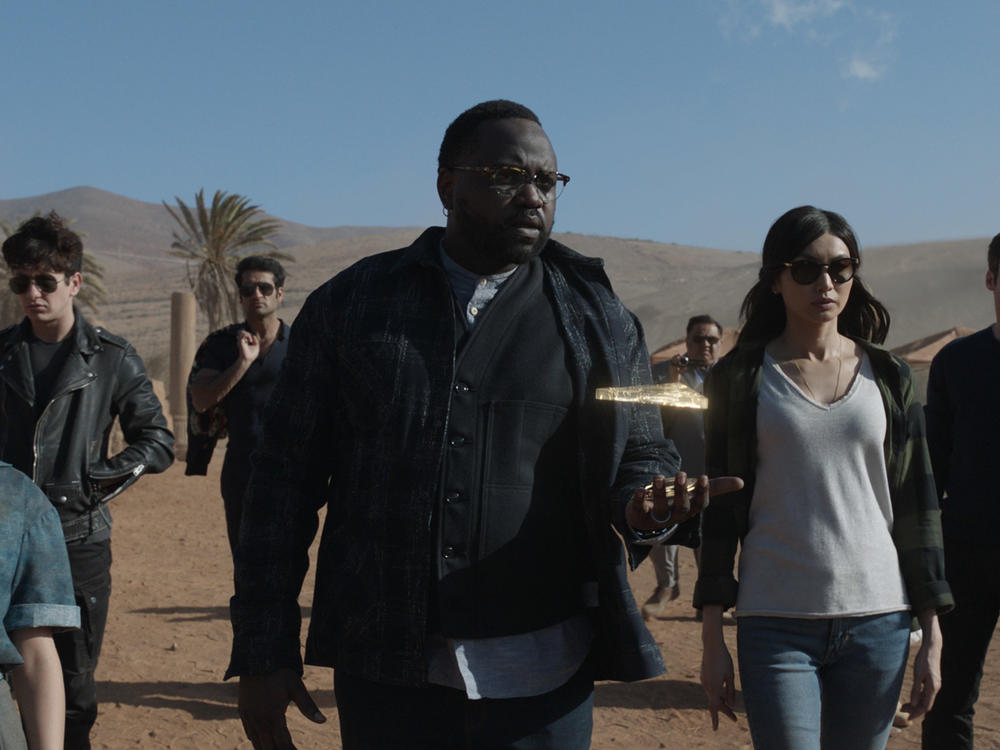 (L-R): Sprite (Lia McHugh), Druig (Barry Keoghan), Kingo (Kumail Nanjiani), Phastos (Brian Tyree Henry), Karun (Harish Patel), Sersi (Gemma Chan) and Ikaris (Richard Madden) in <em>Marvel's Eternals.</em>