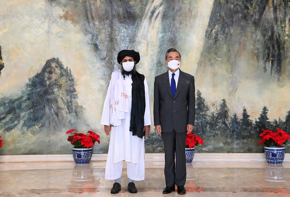 Chinese State Councilor and Foreign Minister Wang Yi (right) meets with senior Afghan Taliban official Mullah Abdul Ghani Baradar in Tianjin, northeastern China, on July 28.