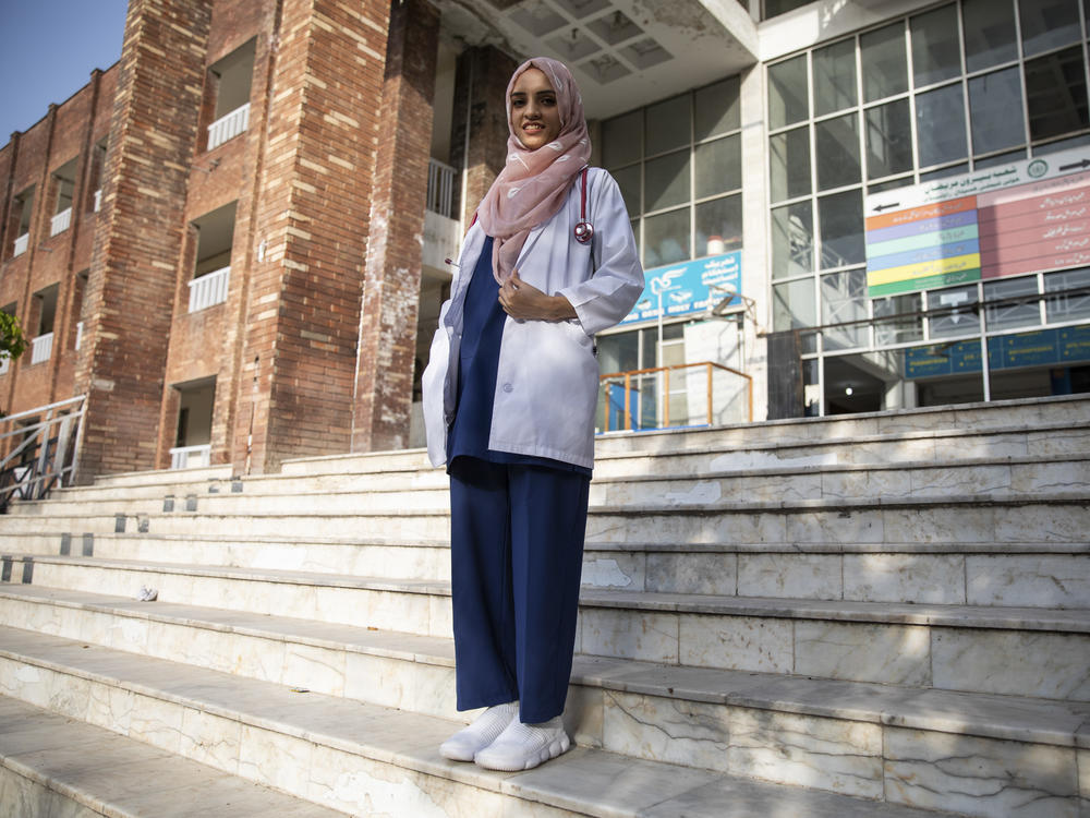 Dr. Saleema Rehman stands outside Holy Family Hospital in Rawalpindi, Pakistan. The Afghan refugee of Turkmen origin has won UNHCR's Nansen Award for her work helping refugee moms and babies in Pakistan.