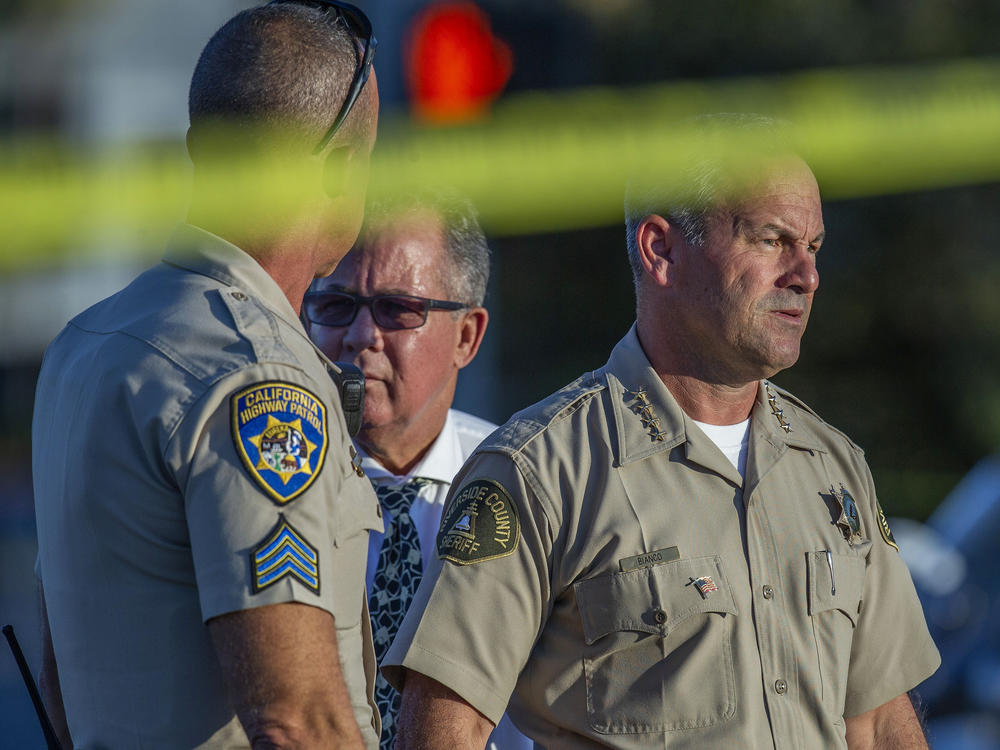 Riverside County Sheriff Chad Bianco, right, with Riverside City Police Chief Sergio G. Diaz and a California Highway Patrol officer, in a photograph taken in 2019.