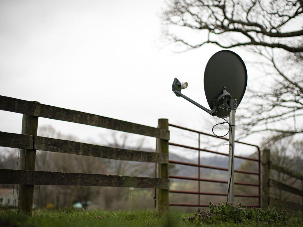 A Viasat internet satellite dish is seen in the yard of a house in Madison, Va., on March 31.