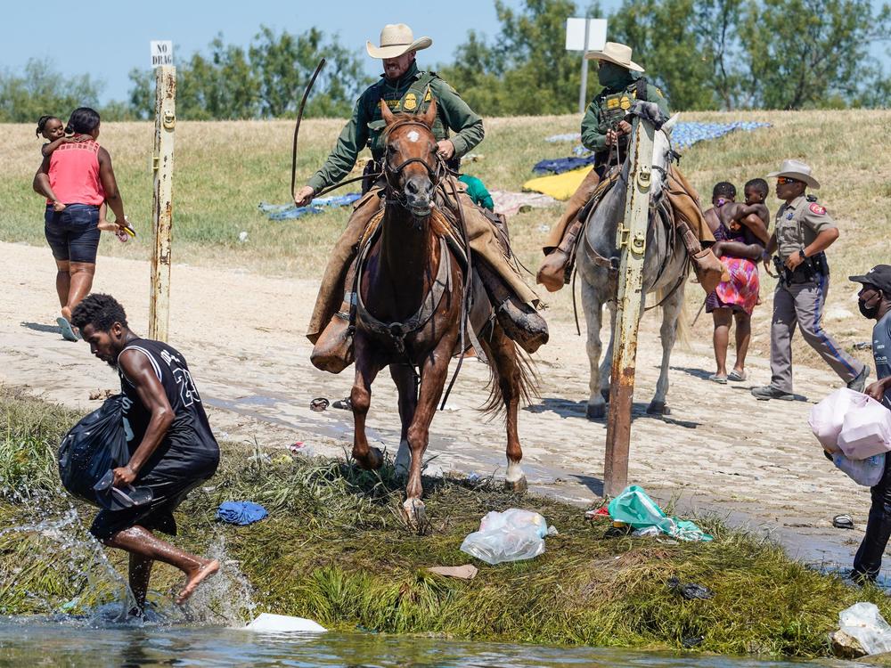 United States Border Patrol agents on horseback try to stop Haitian migrants from entering an encampment on the banks of the Río Grande near the Acuña Del Río International Bridge in Del Río, Texas on Sept. 19.