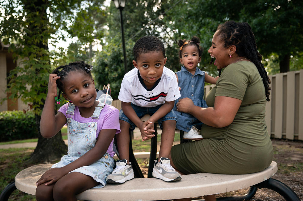Akira Johnson and her children, Paris, Jason and Shakira, at the playground in their apartment community in Columbia, S.C. Like 8 million other Americans, Johnson has been behind on her rent due to the coronavirus pandemic.