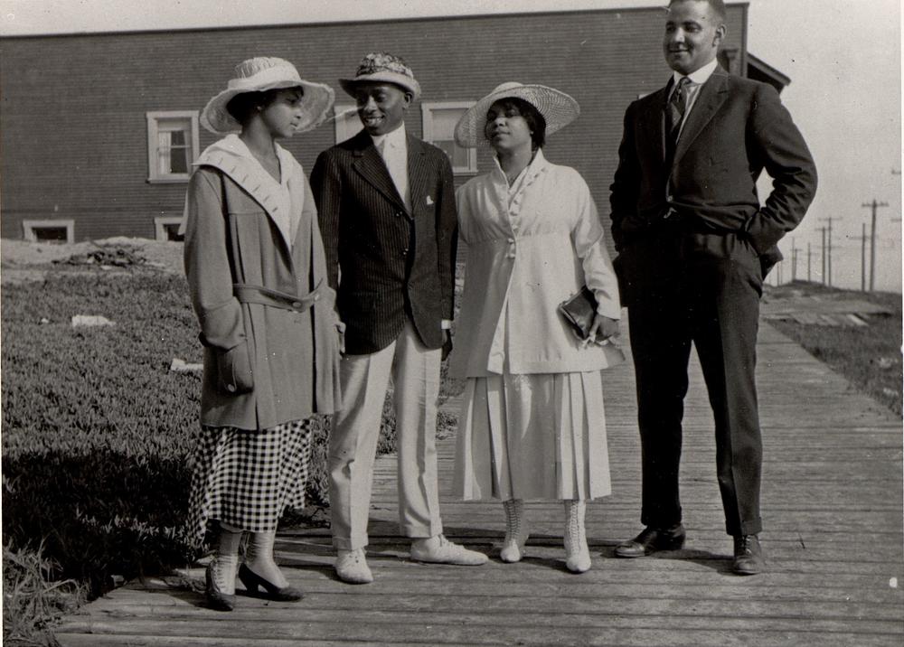 Two African American couples stand on a walkway at Bruce's Beach, Manhattan Beach, circa 1920.