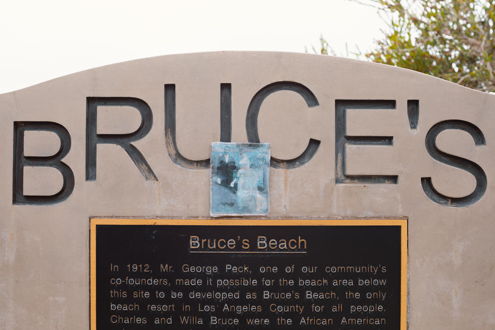 A printed out wedding portrait of Charles Aaron and Willa A. Bruce was placed on top of the plaque.