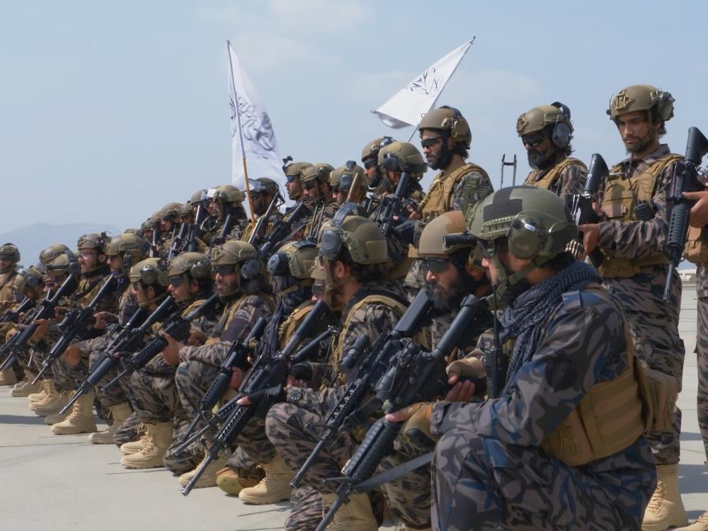 A Taliban military unit stands outside the Kabul airport following the departure of the last U.S. plane from Afghanistan on Aug. 31, 2021.