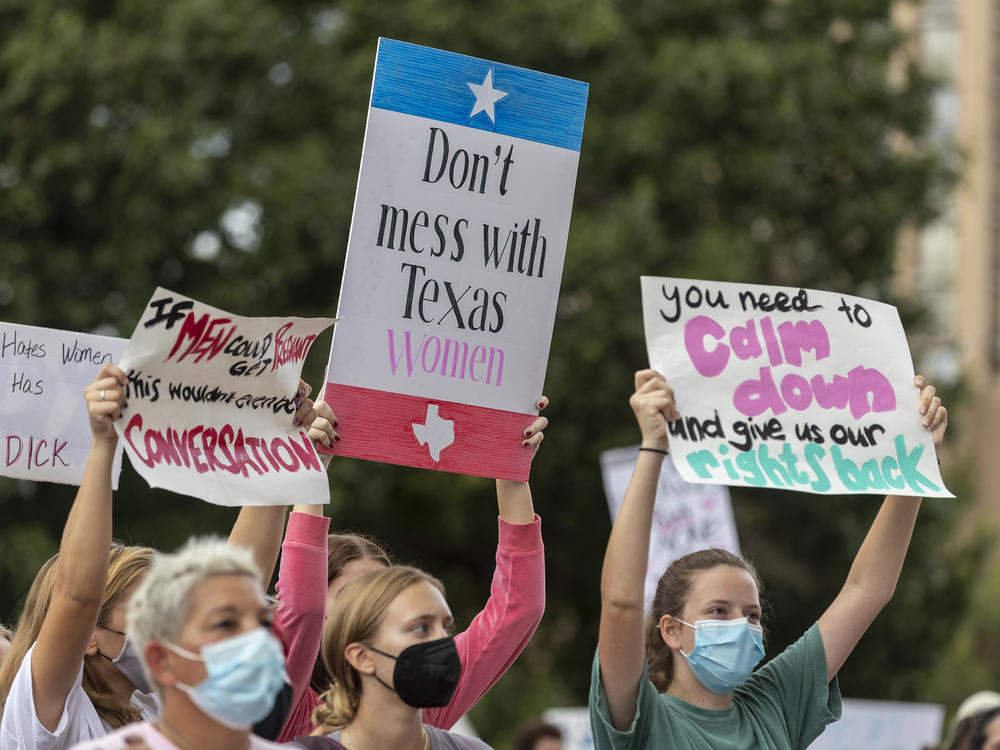 People take part in the Women's March ATX rally in reaction to the controversial ban earlier this month at the Texas State Capitol in Austin.