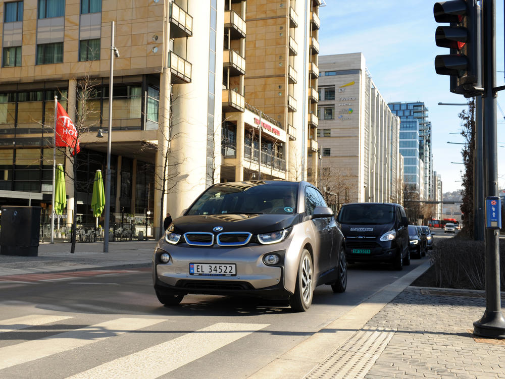 Norway is seeing a record boom in sales of electric cars, which far outpace gas and diesel vehicles. Here, an electric BMW drives on the street in downtown Oslo.