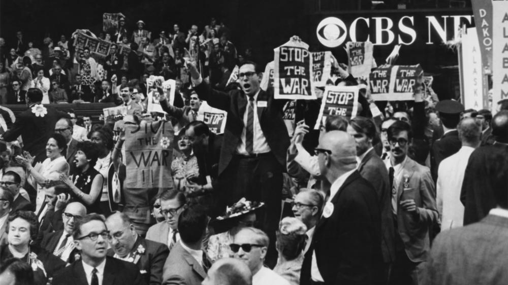 In August 1968, as the Democratic Party met in Chicago for its presidential nominating convention, tens of thousands of protestors swarmed the streets and the turmoil penetrated the convention hall, where delegates opposed to the war in Vietnam disrupted the proceedings.
