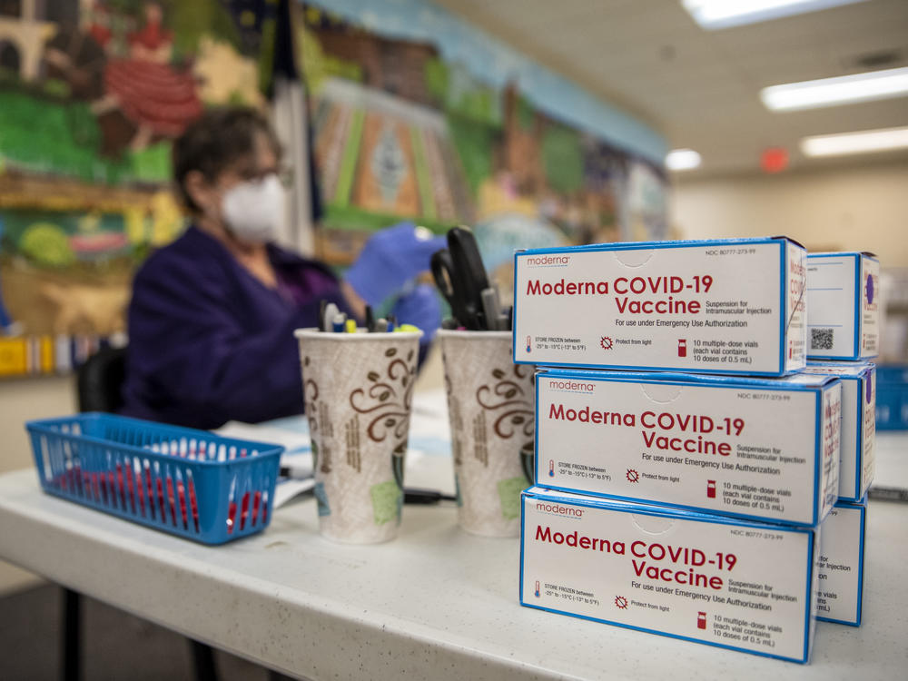 A nurse prepares a dose of the Moderna COVID-19 vaccine at a San Antonio senior center in March. A panel of advisers to the Food and Drug Administration will meet Thursday to review Moderna's booster shot.