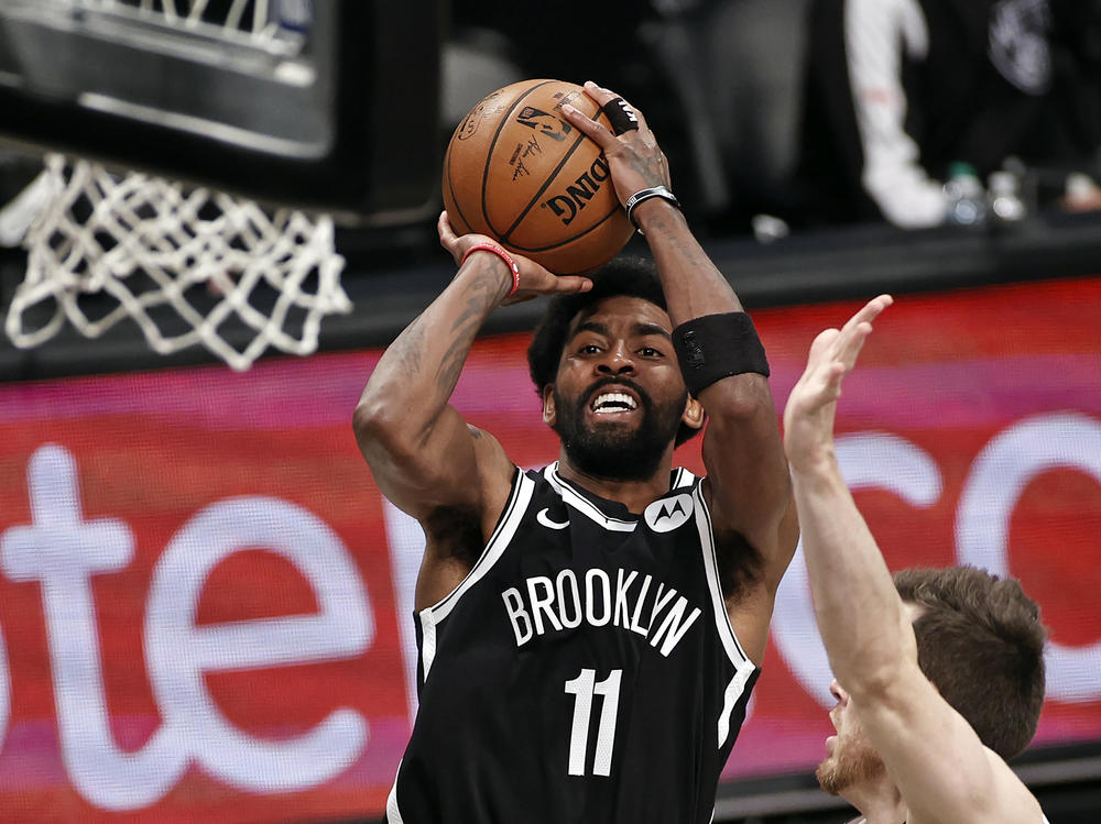 Brooklyn Nets guard Kyrie Irving shoots against the Milwaukee Bucks during Game 1 of an NBA basketball second-round playoff series in New York in June.