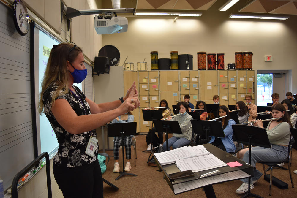 Heather Cote, K-12 Director of Performing Arts at Westwood Public Schools, directs the high school wind ensemble.