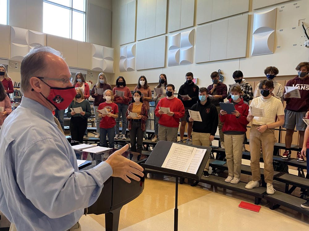 Wellesley High School choral director Kevin McDonald instructs the school's Keynote Singers.