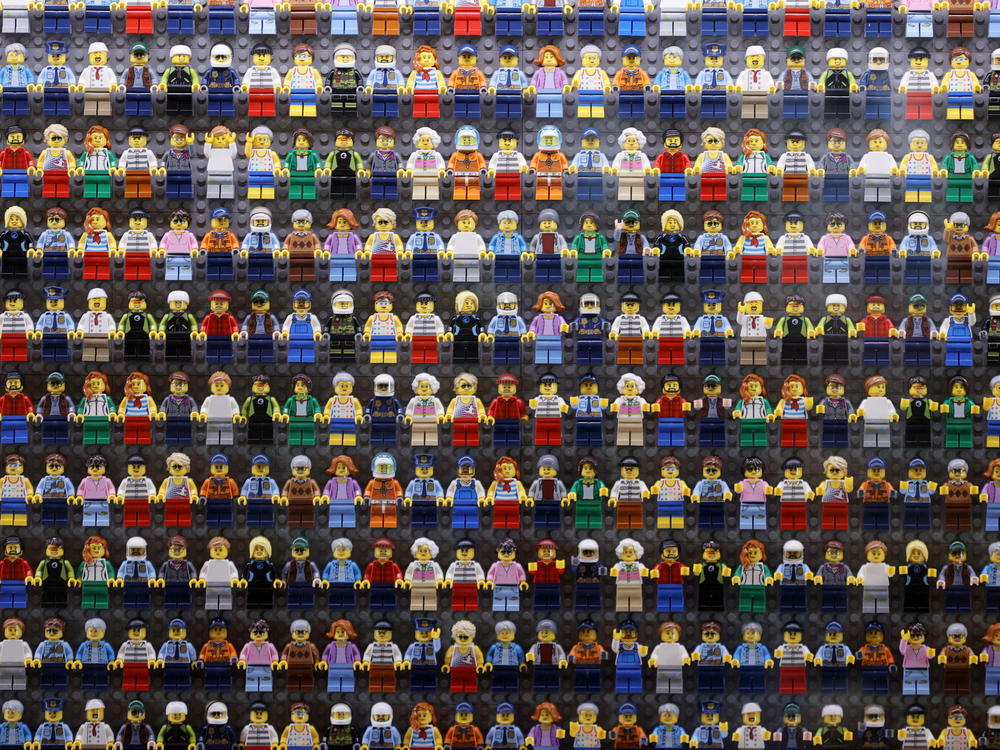 A wall of Lego minifigures is encased inside the lobby of the Legoland Hotel in Goshen, N.Y. on Aug. 6. The Danish company is pledging to remove harmful stereotypes from its products and marketing.