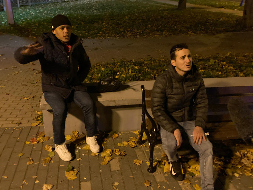 Raydel Aparicio Bringa (left) and Doniel Machado Pujol are photographed while being apprehended by Poland's Border Guard in the town of Sokolka, on the Polish border with Belarus. The two men, from Cuba, are among thousands of migrants from impoverished or war-torn countries that the regime of Alexander Lukashenko is accused of luring to Belarus to be sent across the border into the EU.