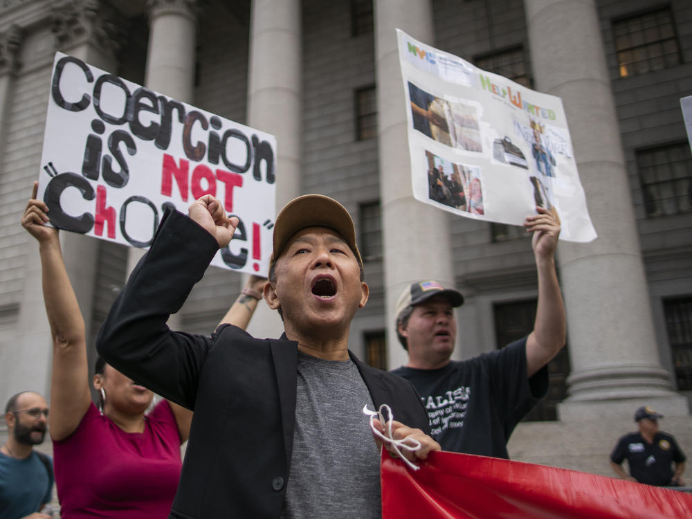 People and teachers protest against COVID-19 vaccine mandates outside the Manhattan Federal Court on Tuesday in New York.