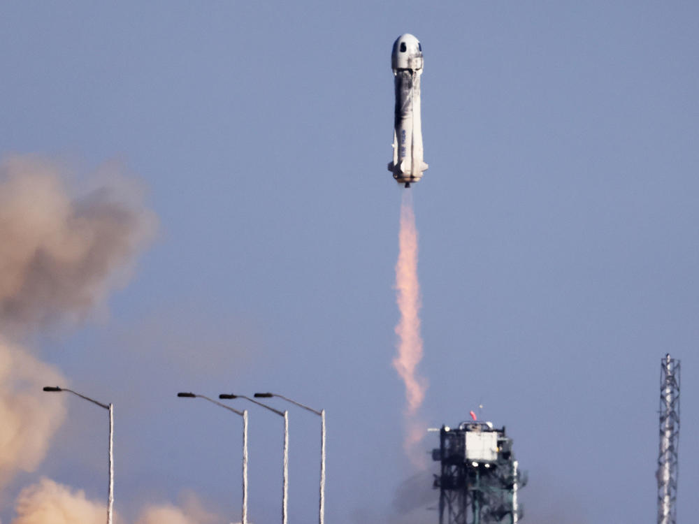 Blue Origin's New Shepard rocket system lifts off from the launchpad carrying 90-year-old Star Trek actor William Shatner and three other civilians near Van Horn, Texas, on Wednesday.