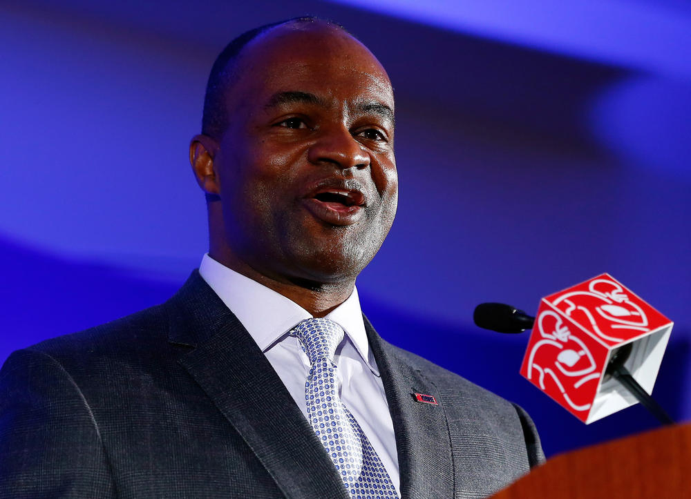 DeMaurice Smith, executive director of the NFL Players Association, speaks during a news conference in 2014.