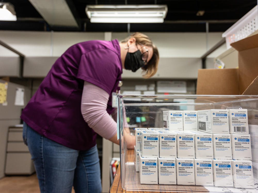 Janet Gerber, a health department worker in Louisville, Ky., processes boxes containing vials of the Johnson & Johnson COVID vaccine in March.