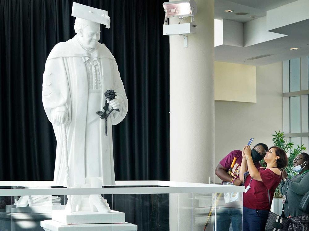 Members of the public view the newly unveiled statue of Mary McLeod Bethune at the News-Journal Center in Daytona Beach on Oct. 12. It's slated to move to the U.S. Capitol's National Statuary Hall early next year.