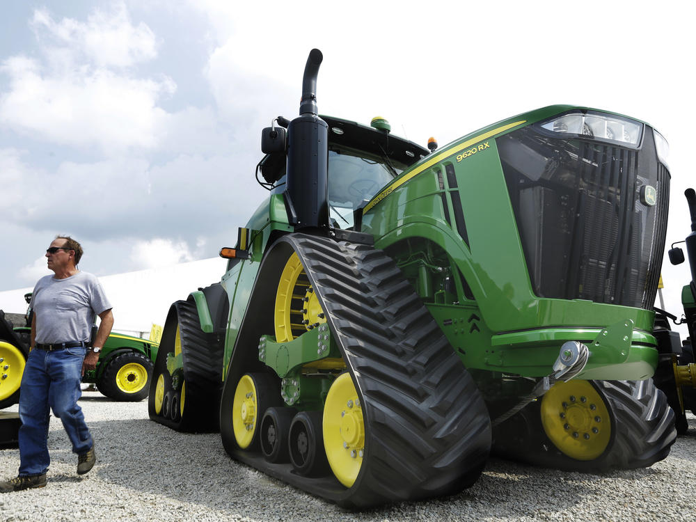 John Deere is known for its signature green and yellow farm equipment, like this equipment on display in 2015 at the Farm Progress Show in Decatur, Ill.