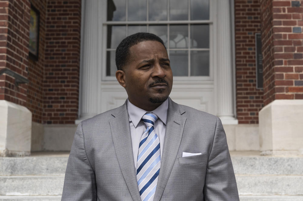 Pastor John Perry in front of City Hall in downtown Brunswick. On the justice system and the differences between how white and Black people are treated, 