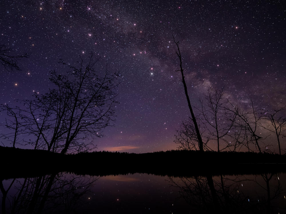 A scenic view of a lake against the sky at night in British Columbia. Earlier this month, a resident of Golden, B.C., woke up to the sound of a crash and found that a meteorite had landed in her bed.