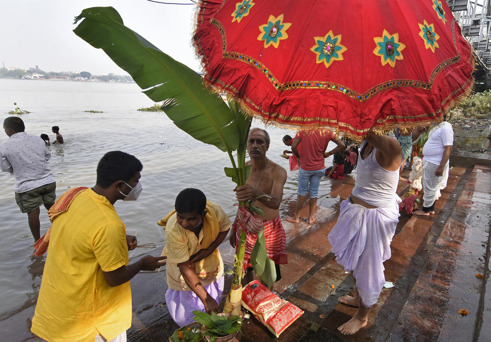 Devotees perform a ritual for Durga Puja.
