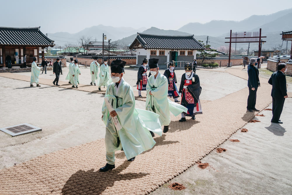 Men enter Museong Seowon, a Confucian academy in Jeongeup, South Korea, to participate in the spring ceremony in April.