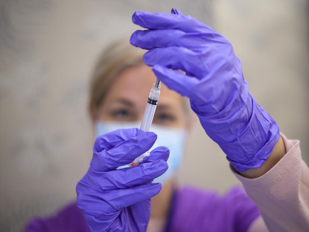 A nurse draws a vaccine dose from a vial of Moderna's COVID-19 vaccine at a community center in Bowie, Md., in March.