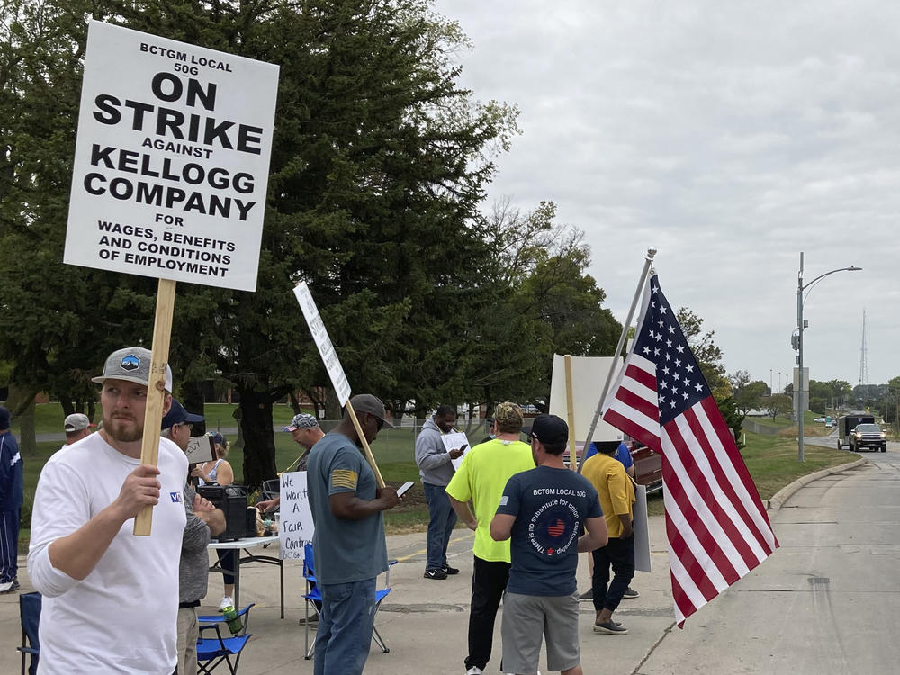 Workers from a Kellogg cereal plant picket along the main rail lines leading into the facility on Oct. 6 in Omaha, Neb. Workers have gone on strike after a breakdown in contract talks with company management.