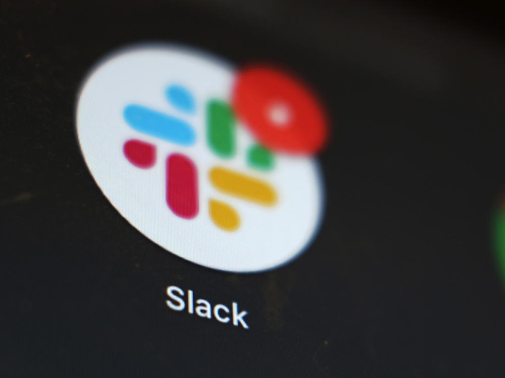 The Slack app icon is displayed on a computer screen on Dec. 2, 2020, in Tokyo. Salesforce completed a deal to buy the popular work messaging platform earlier this year.