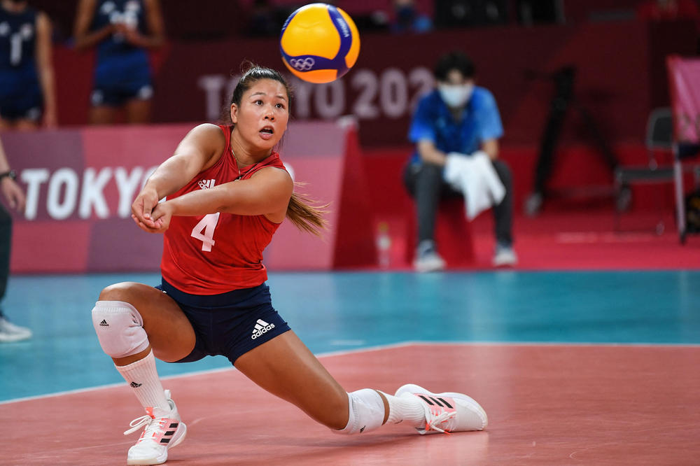 Team USA's Justine Wong-Orantes hits the ball in a match against Serbia during the Tokyo Olympics on Aug. 6, 2021. She won a gold medal with her teammates. Because the U.S. doesn't have a pro league, she's currently playing in Germany.