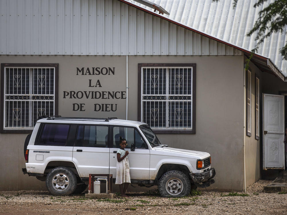 Children stand in the courtyard of the Maison La Providence de Dieu orphanage it Ganthier, Croix-des-Bouquets, Haiti, Sunday, Oct. 17, 2021, where a gang abducted 17 missionaries from a U.S.-based organization. The 400 Mawozo gang, notorious for brazen kidnappings and killings took the group of 16 U.S. citizens and one Canadian, after a trip to visit the orphanage.