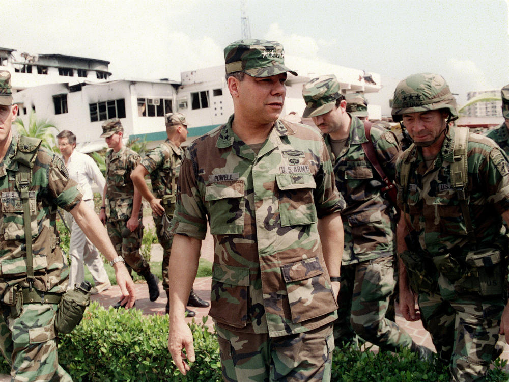 Gen. Colin Powell, head of the Joint Chiefs of Staff, tours the bombed courtyard of the Panamanian Defense Force Comandancia in Panama City during the U.S. invasion of Panama on Jan. 5, 1990.