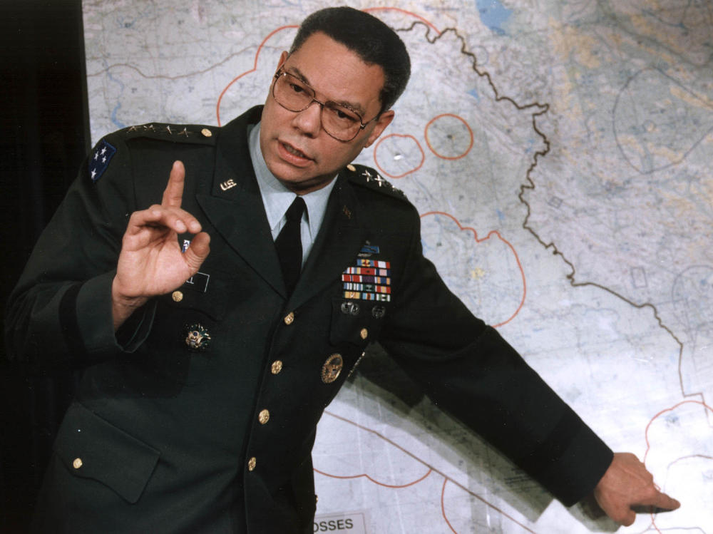 Colin Powell, chairman of the Joint Chiefs of Staff, references Iraqi troops in Kuwait during a briefing at the Pentagon on Jan. 23, 1991.