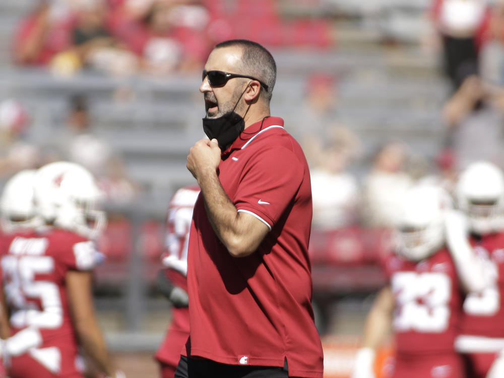 Washington State University head coach Nick Rolovich speaks to his players before an NCAA college football game against Portland State on Sept. 11 in Pullman, Wash.