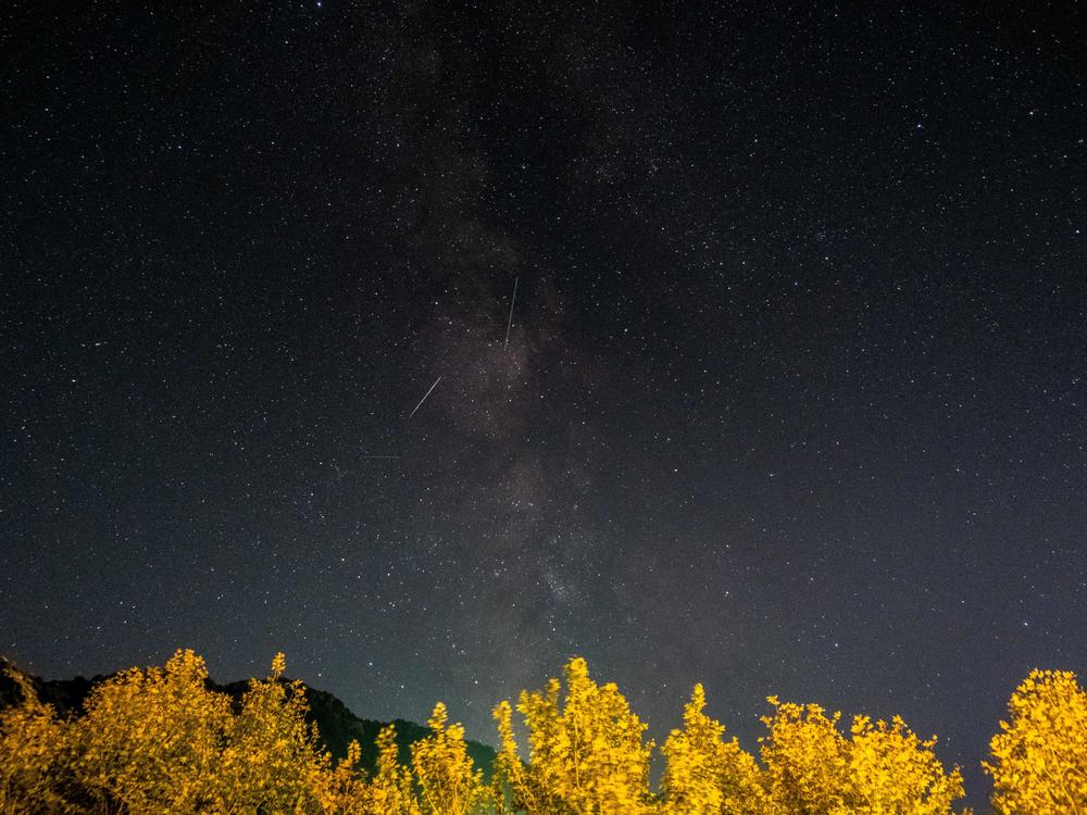 Meteors from the Orionid meteor shower streak as they cross through the Milky Way in the mountainous area of Tannourine in northern Lebanon, on October 3, 2021.