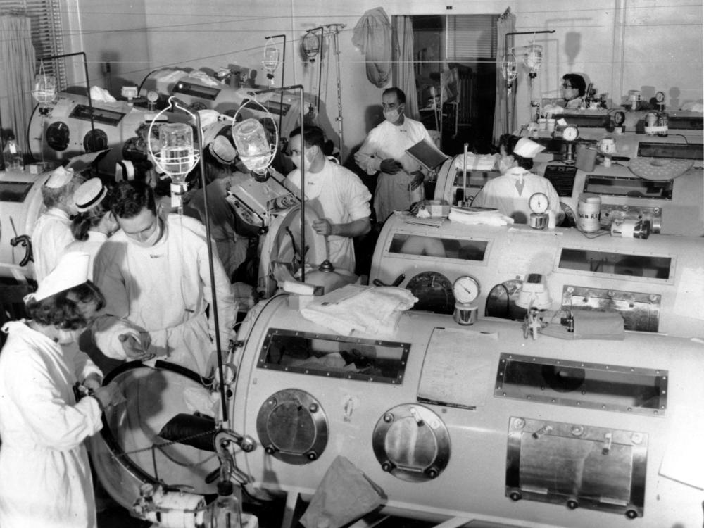 Iron lung respirators are prepared in an emergency polio ward at a Boston hospital in August 1955.