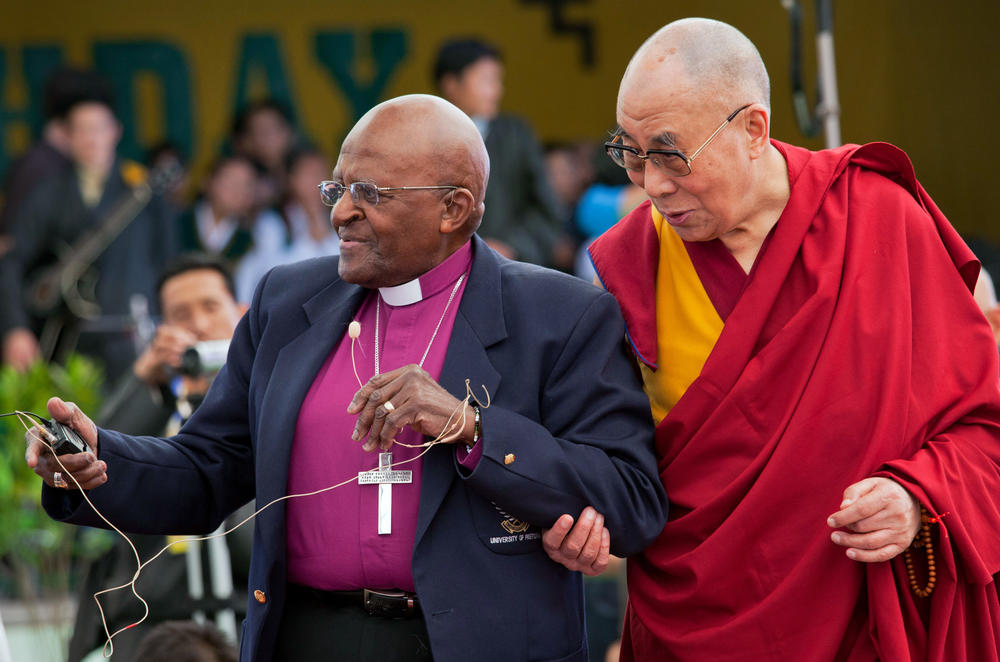 Retired Archbishop Desmond Tutu and Tibetan spiritual leader the Dalai Lama interact with children at the Tibetan Children's Village School in Dharmsala, India, in 2015. The two Nobel laureates held a series of conversations in Dharmsala aimed at giving shape to their collaborative work, <em>The Book of Joy</em>.