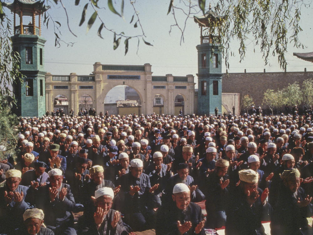 Xining's Dongguan Mosque has been a source of community for Chinese Muslims for seven centuries. Here, Hui Muslim men pray in the mosque in 1983.