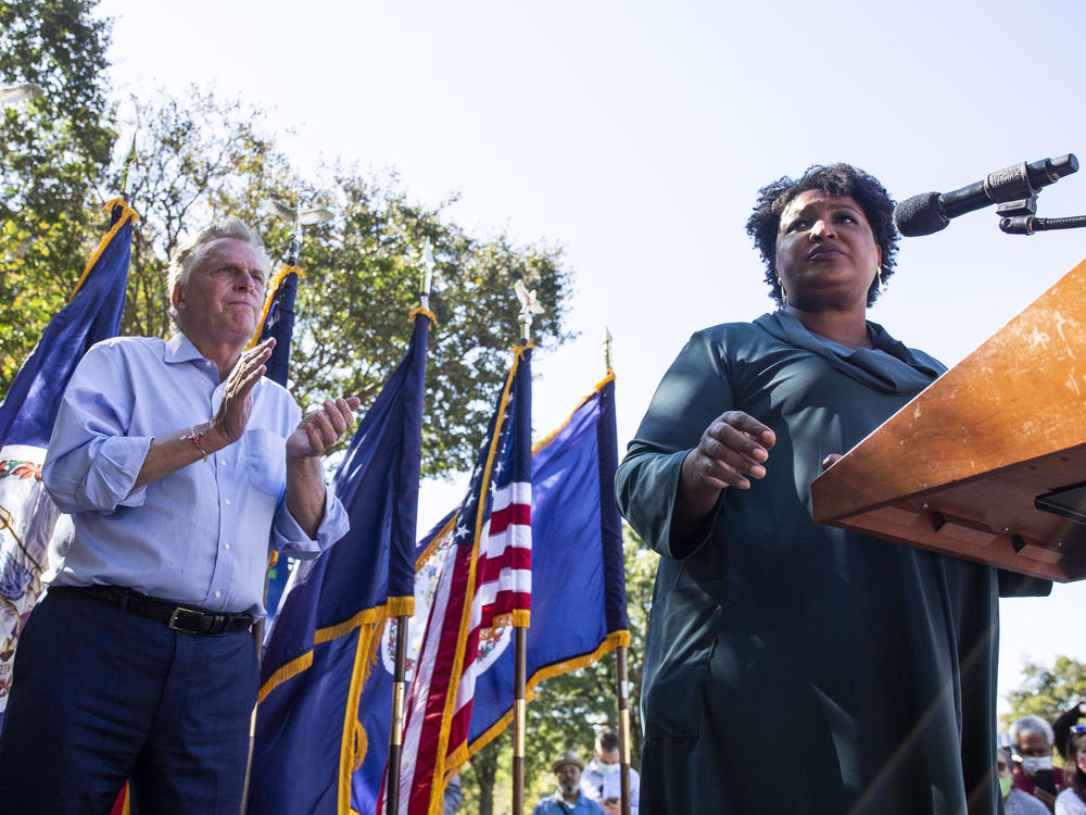 Voting rights activist Stacey Abrams speaks during an Oct. 17 rally in Norfolk supporting Terry McAuliffe in his bid to reclaim the Virginia governor's office. To drum up enthusiasm, Democrats have brought in some of their biggest names.