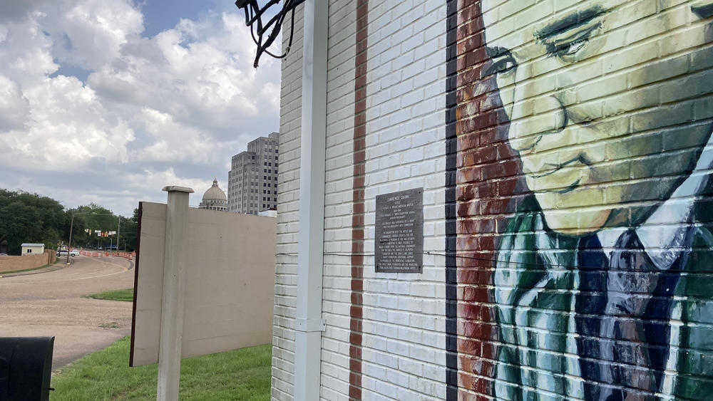 A mural of writer Richard Wright is painted on the wall of the Smith Robertson Museum, a few blocks from the Mississippi State Capitol.