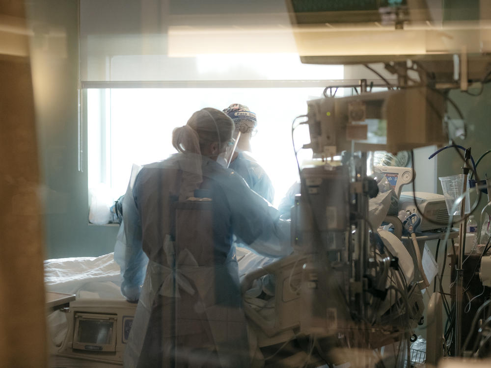Nurses check on a patient in a Jonesboro, Ark., ICU in August when the delta variant sparked yet another surge of serious COVID-19 cases in the region. The pandemic has only added to a longstanding nursing shortage in the U.S., statistics show.