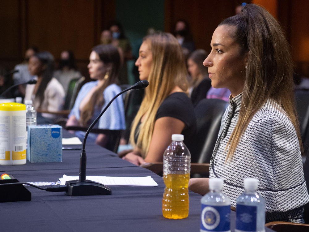 (L-R) U.S. Olympic gymnasts Simone Biles, McKayla Maroney, gymnast Maggie Nichols, and U.S. Olympic gymnast Aly Raisman, testify during a Senate hearing about the Inspector General's report on the FBI handling of the Larry Nassar investigation of sexual abuse of Olympic gymnasts, on Capitol Hill, September 15, 2021, in Washington, DC.