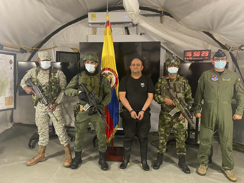 In this photo released by the Colombian presidential press office, one of the country's most wanted drug traffickers, Dairo Antonio Usuga, alias 