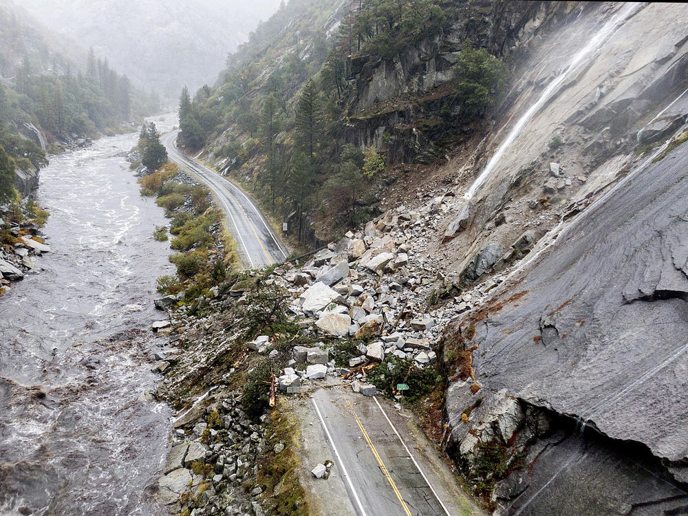 Rocks and vegetation cover Highway 70 Sunday, following a landslide in the Dixie Fire zone.