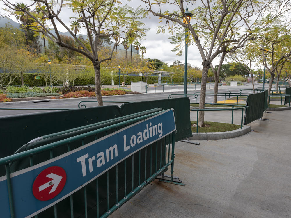 A tram-loading area stands vacant on the first day of the closure of Disneyland and Disney California Adventure theme parks in Anaheim, Calif., on March 14, 2020, because of fear of the spread of the coronavirus.